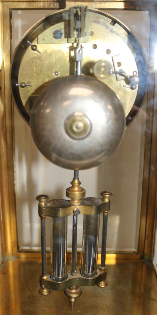 A Victorian brass four glass mantel clock, 12in.